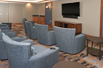 A room filled with furniture and a flat screen tv